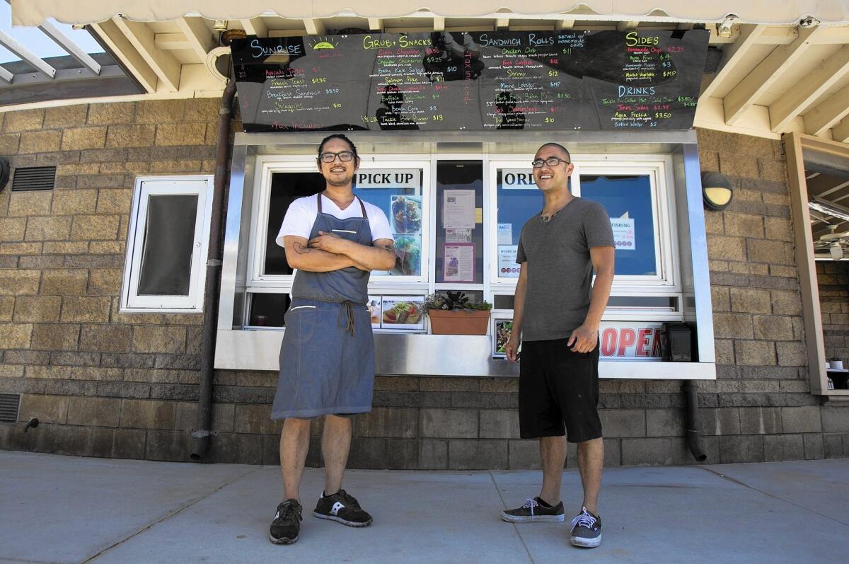 Brian Huskey, left, and his brother and co-founder Andrew Huskey at the Tacklebox Local Grub Shack on Thursday.