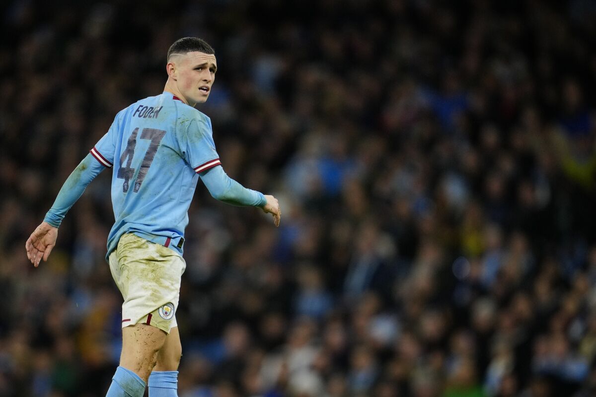 Manchester City's Phil Foden reacts during the English FA Cup quarter final soccer match between Manchester City and Burnley at the Etihad stadium in Manchester, England, Saturday, March 18, 2023. (AP Photo/Jon Super)