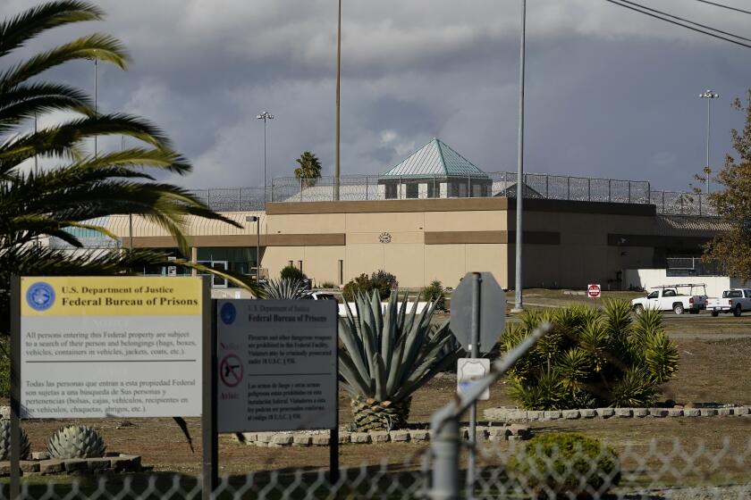 FILE - The Federal Correctional Institution stands in Dublin, Calif., on Dec. 5, 2022. Federal investigators on Monday, March 11, 2024, are again searching the troubled women's prison, seizing computers and documents in an apparent escalation of a yearslong sexual abuse investigation that led to previous charges against a former warden and other employees. (AP Photo/Jeff Chiu, File)