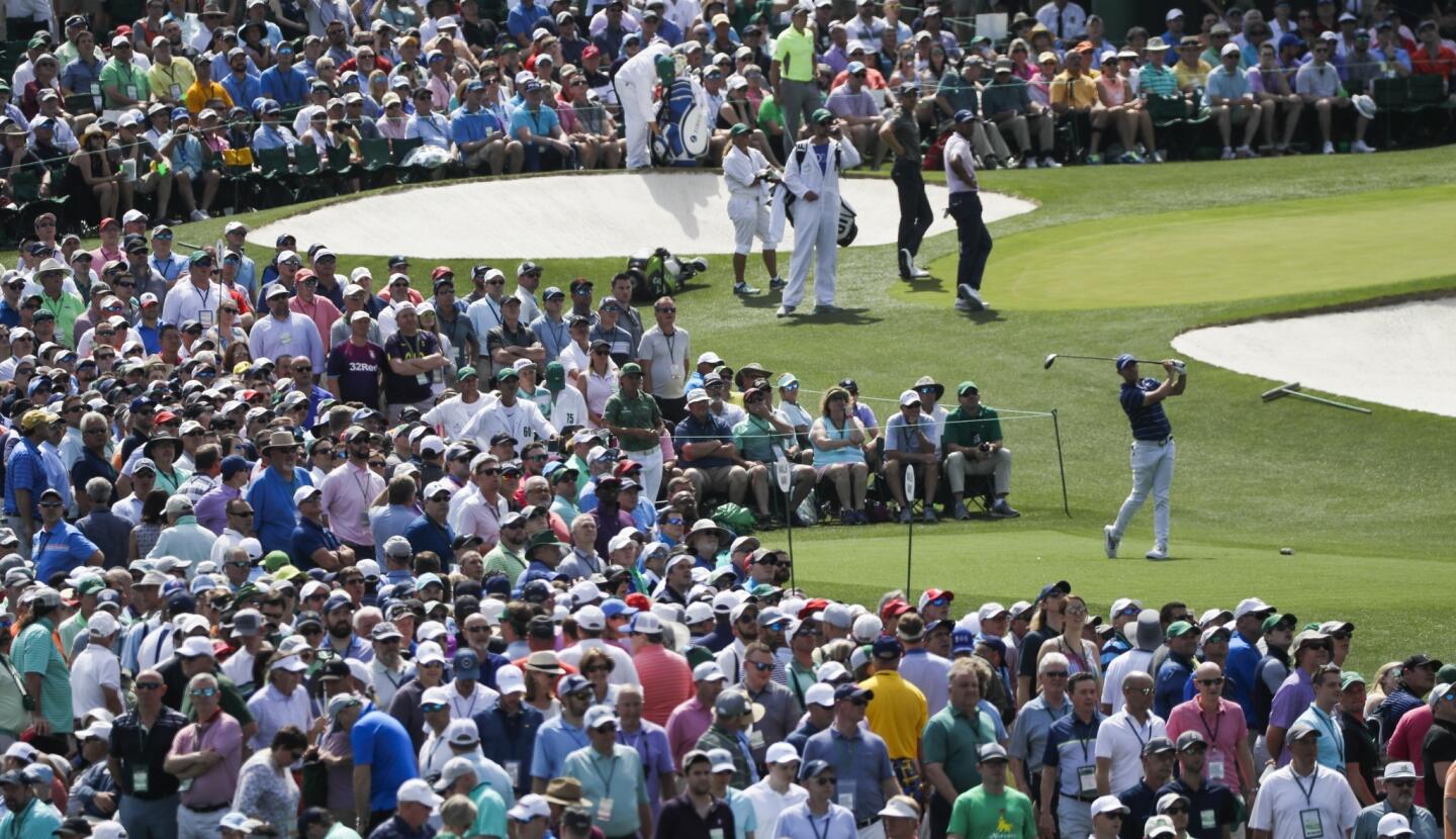 Rory McIlroy, of Northern Ireland, hits from the third tee during the first round for the Masters golf tournament in Augusta.