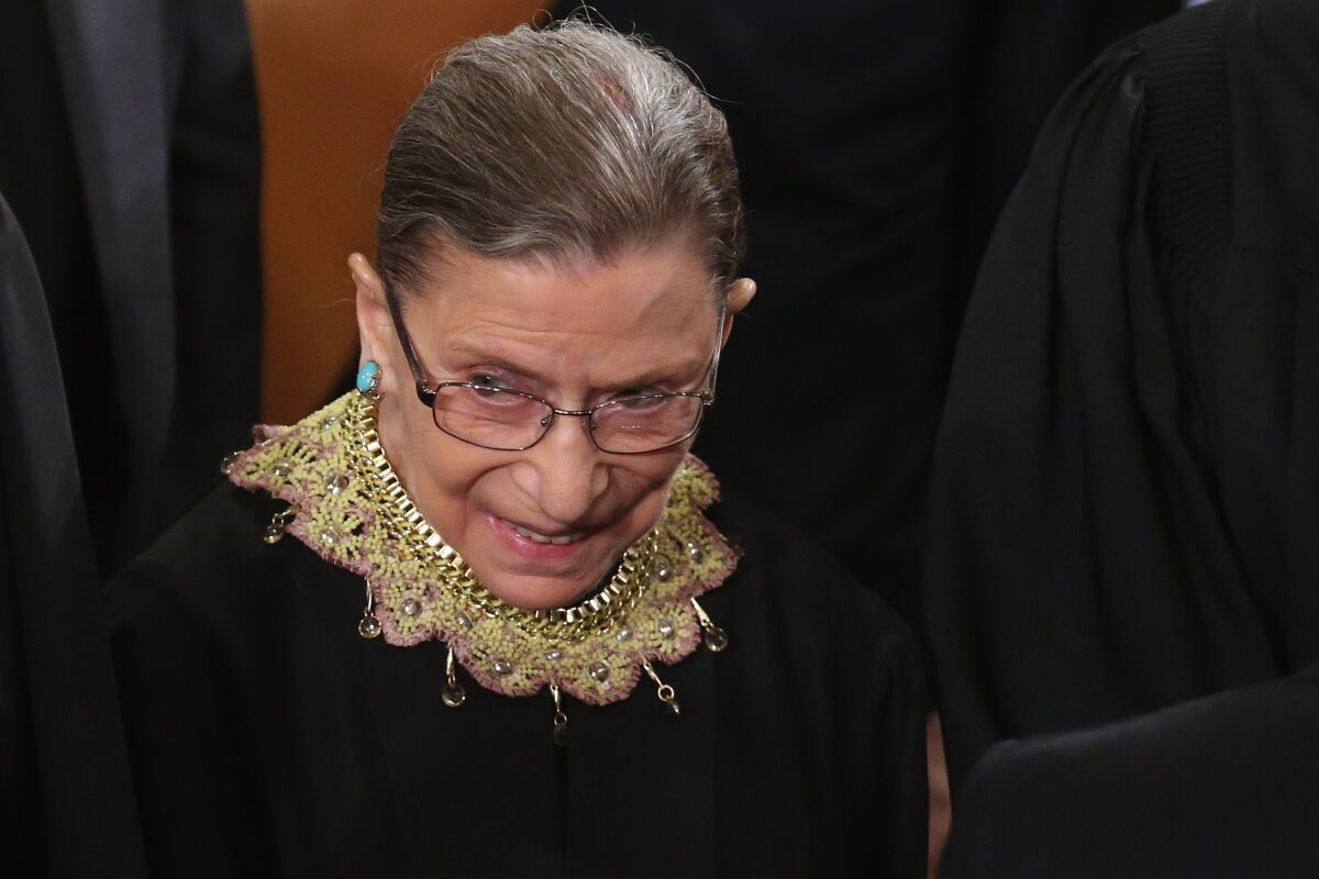 Ruth Bader Ginsburg wearing her majority opinion collar