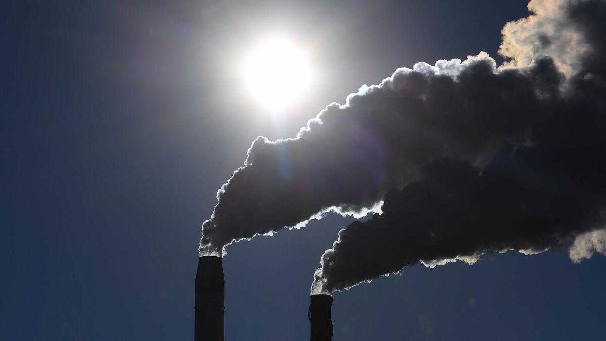 Emissions rise from a factory at Broadwater in far northern New South Wales, Australia. (Dave Hunt / European Pressphoto Agency)