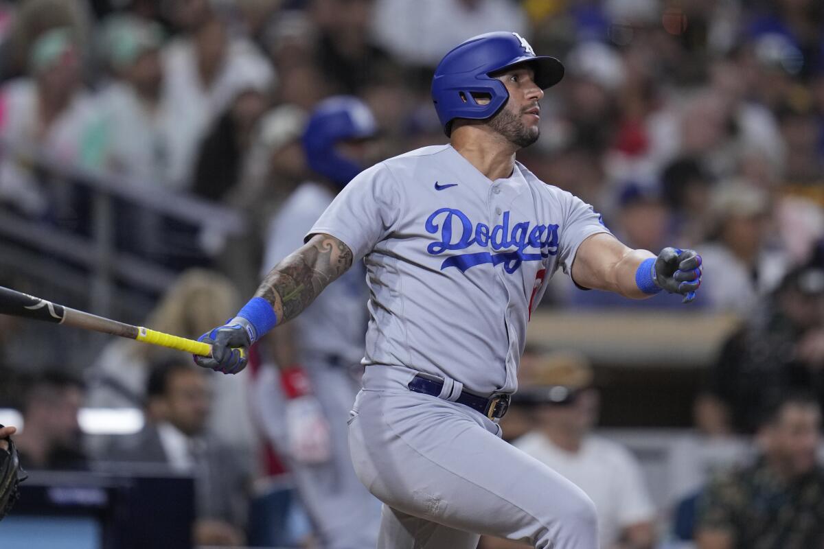 David Peralta hits a ground-rule double for the Dodgers in the seventh inning against the San Diego Padres on Friday.