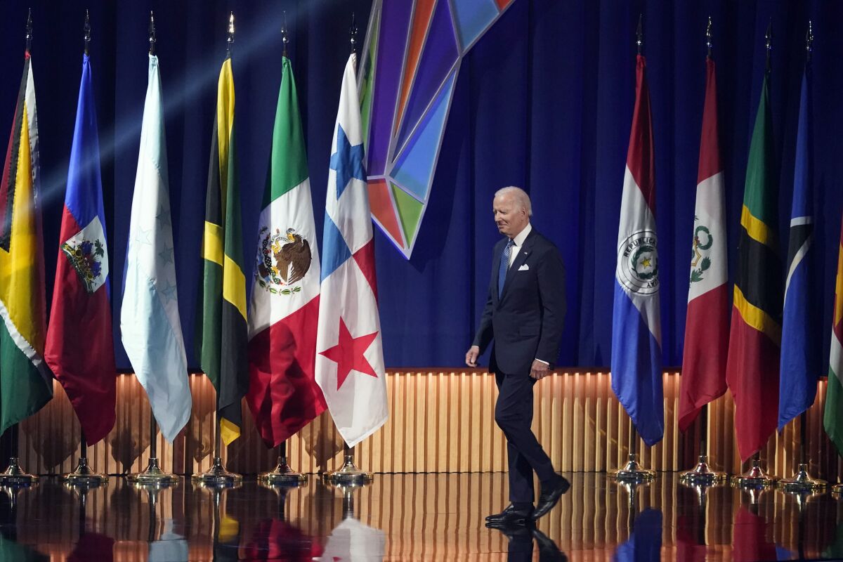 President Biden walks on stage during the opening ceremony at the Summit of the Americas