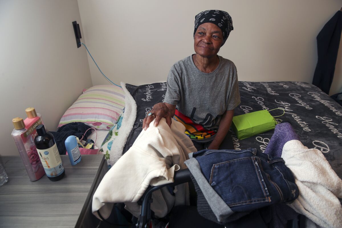 Cynthia Taylor-Davis, 72, sits in her room at the Oasis, a new 40-bed interim housing recuperative care facility in skid row.