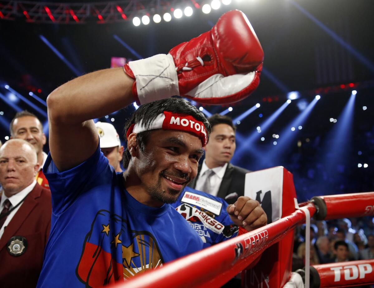 Manny Pacquiao acknowledges the fans as he prepares to enter the ring for his title fight against Timothy Bradley.