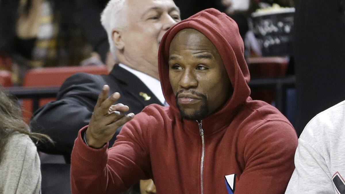 Floyd Mayweather Jr. attends a game between the Miami Heat and Milwaukee Bucks in Miami on Jan. 27.
