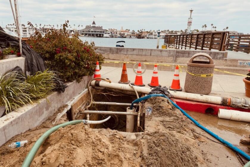 Pictured is one of the excavation pits that were dug to address the underwater pipe leak on Opal Street on Balboa Island.