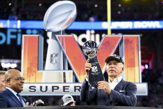 Inglewood, CA - February 13: Los Angeles Rams owner Stan Kroenke holds onto the Lombardi Trophy after defeating the Cincinnati Bengals 23-20 in Super Bowl LVI at SoFi Stadium on Sunday, Feb. 13, 2022 in Inglewood, CA.(Wally Skalij / Los Angeles Times)