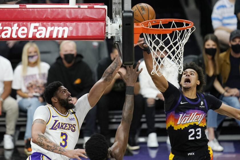 Los Angeles Lakers forward Anthony Davis (3) has his shot altered by Phoenix Suns forward Cameron Johnson.
