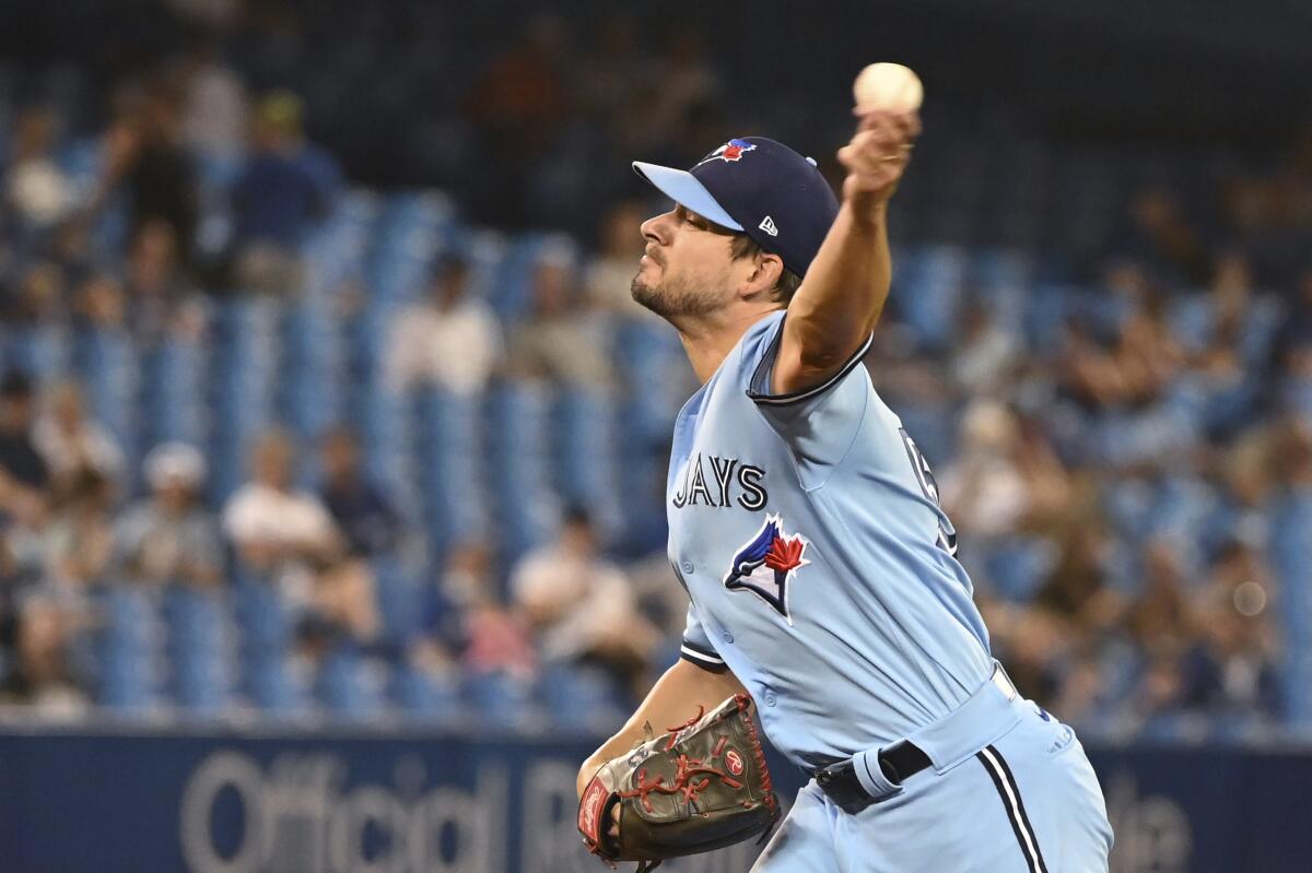Toronto Blue Jays' Brad Hand pitches to a Chicago White Sox batter during the sixth inning of a baseball game Thursday, Aug. 26, 2021, in Toronto. (Jon Blacker/The Canadian Press via AP)