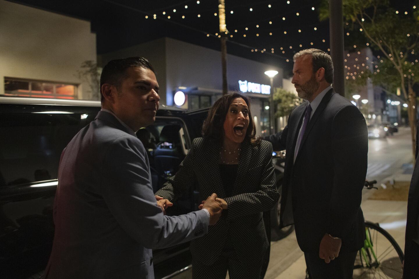 Kamala Harris recognizes a friend in the crowd during a visit to Long Beach.