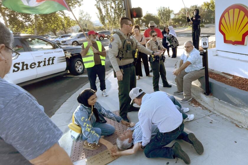 A video screen grab shows Paul Kessler receiving medical aide after suffering a head injury at a Thousand Oaks protest centered on the Israel-Hamas war on Nov. 5.