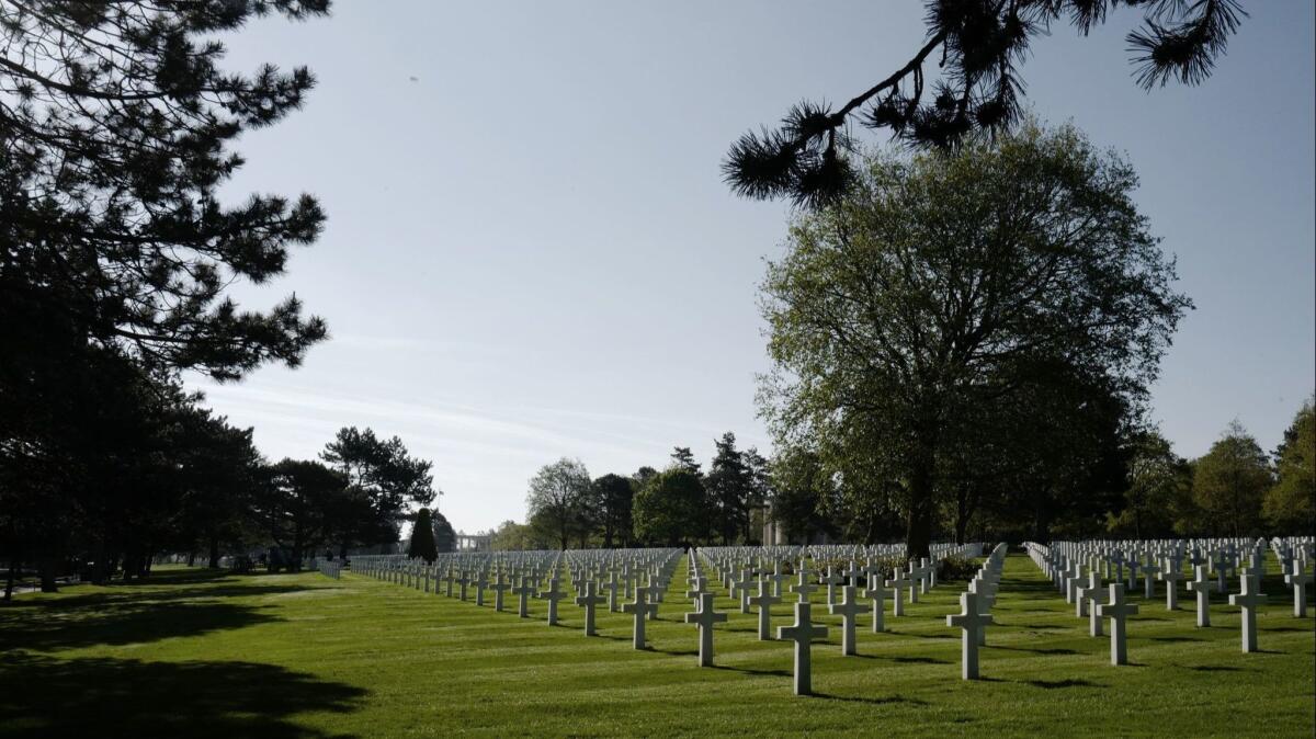 A view of tombstones at the World War II Normandy American Cemetery and Memorial at Colleville-sur-Mer, above Omaha Beach, Normandy, where troops landed June 6, 1944.