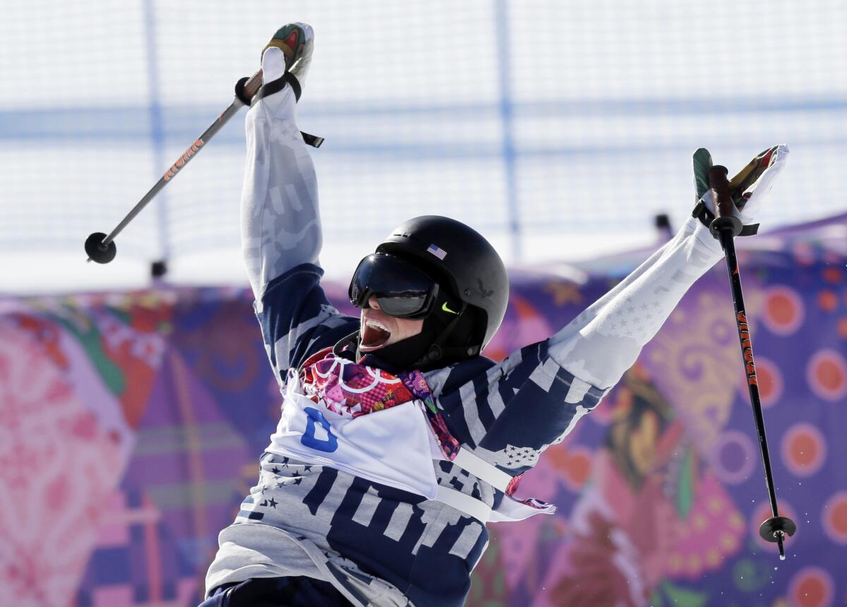 Gus Kenworthy celebrates at the end of his second run in the men's slopestyle skiing final at the 2014 Sochi Olympics, where he won a silver medal.