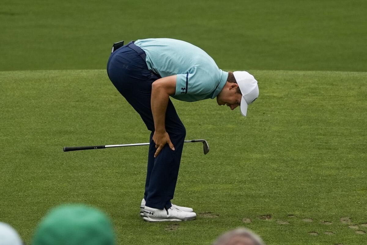 Jordan Spieth reacts after teeing off on the 12th hole during the second round of the Masters on Friday.