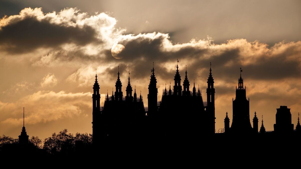 The sun sets behind the Houses of Parliament in London on Nov. 17, 2018. British Prime Minister Theresa May said she will resist any effort to push her from power.