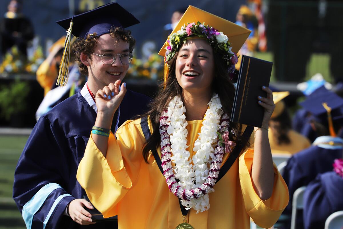 Mika Ikemori celebrates after receiving her diploma during Marina High School's 2023 Commencement Ceremony on Thursday.
