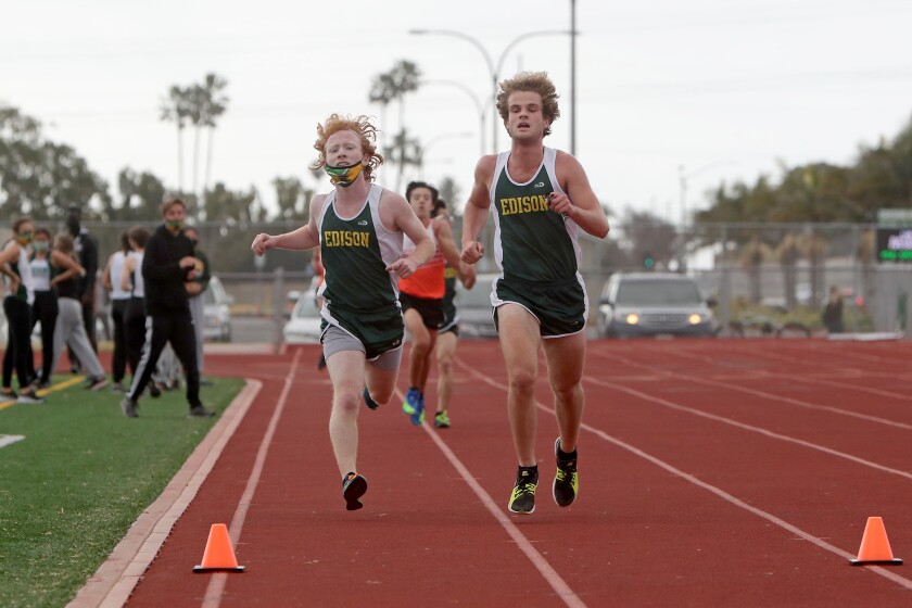 Edison's Jeff Ritter, right, and Luke Fowler, left, finish third and fourth against Huntington Beach on Saturday, Feb. 13.