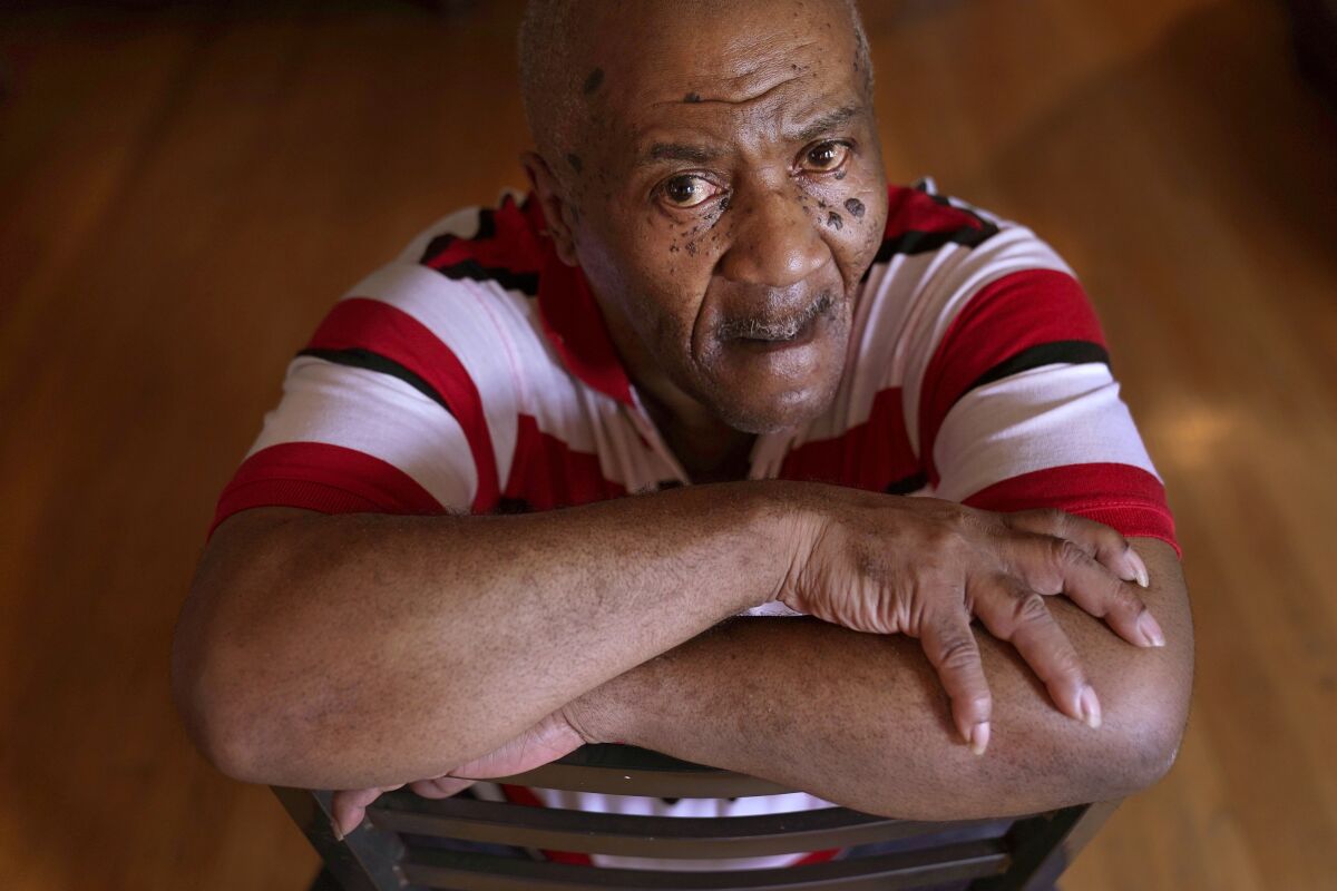 FILE - Michael Williams sits for a portrait in his South Side Chicago home Tuesday, July 27, 2021. Williams was behind bars for nearly a year before a judge dismissed the murder case against him in July 2021 at the request of prosecutors, who then said they had insufficient evidence. A lawsuit filed in federal court on Thursday, July 21, 2022, alleges that Chicago police misused “unreliable” gunshot detection technology and displayed tunnel vision in investigating Williams and charging him with killing a neighbor. (AP Photo/Charles Rex Arbogast)