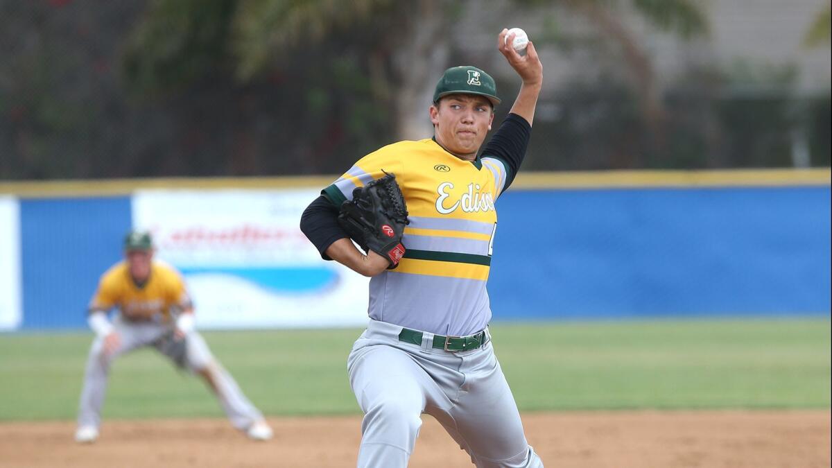 Matt Swartz, shown pitching for the Edison High baseball team on May 2, 2018, earned the win in relief for the Chargers in Friday's Surf League win at Los Alamitos.