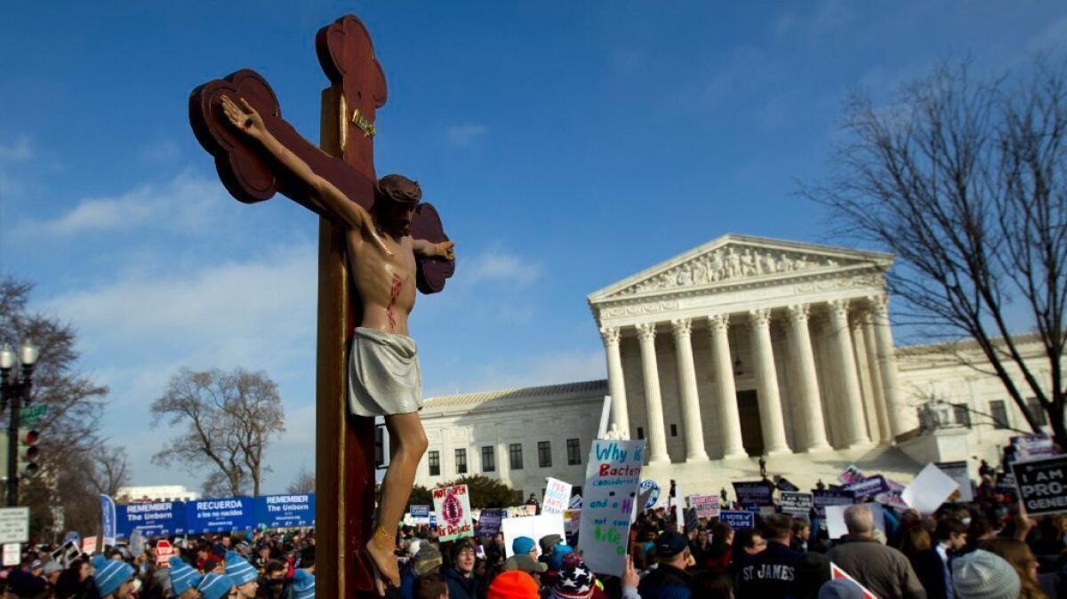 Anti-abortion protestors demonstrate outside the U.S. Supreme Court building on Jan. 18.