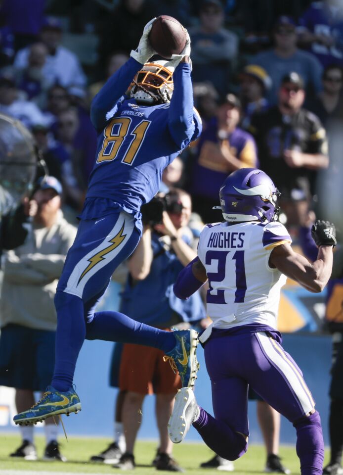 Chargers wide receiver Mike Williams catches a pass over Minnesota Vikings cornerback Mike Hughes.