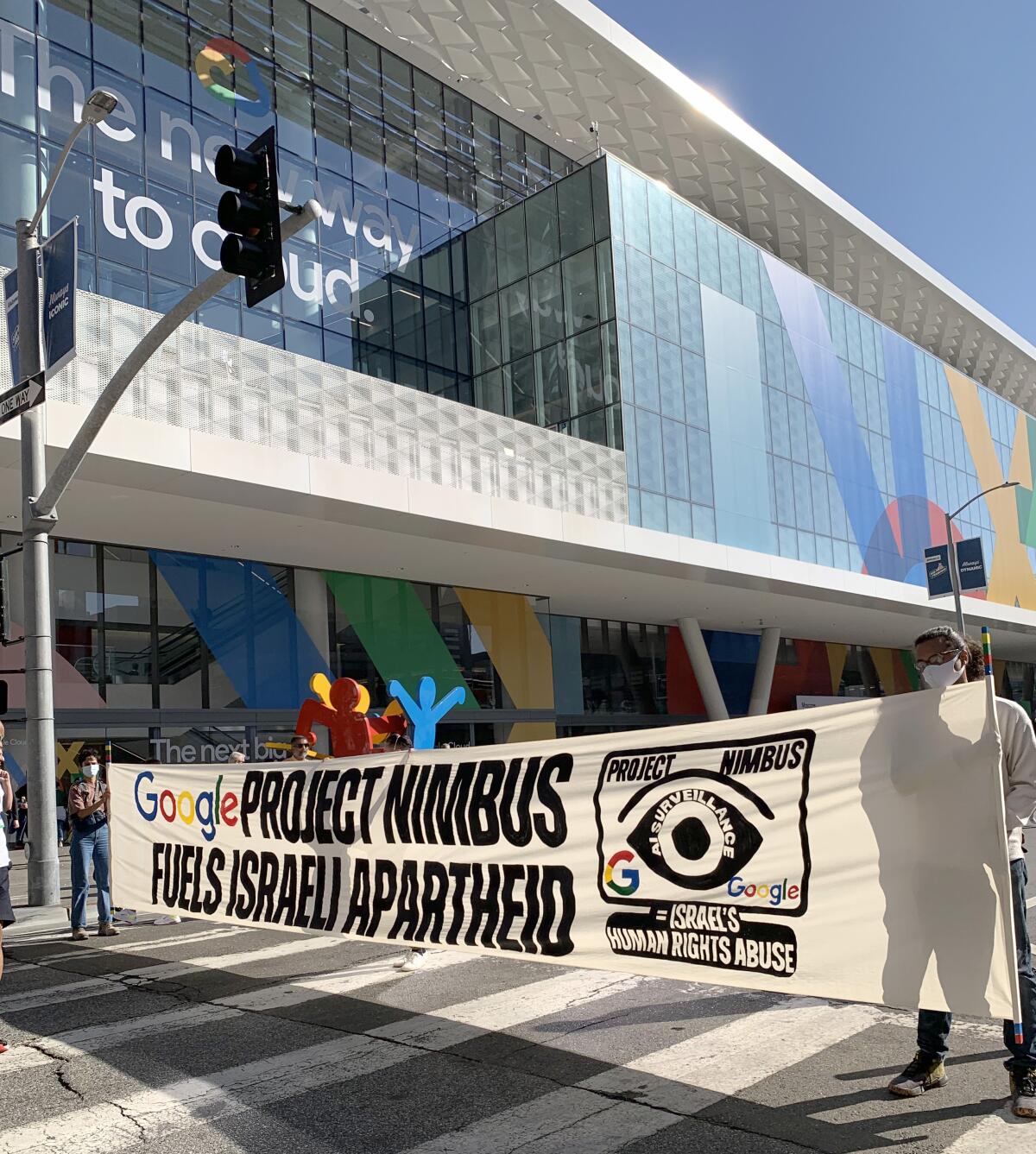 Google workers and local activists protest with a banner reading: "Google Project Nimbus fuels Israeli apartheid."
