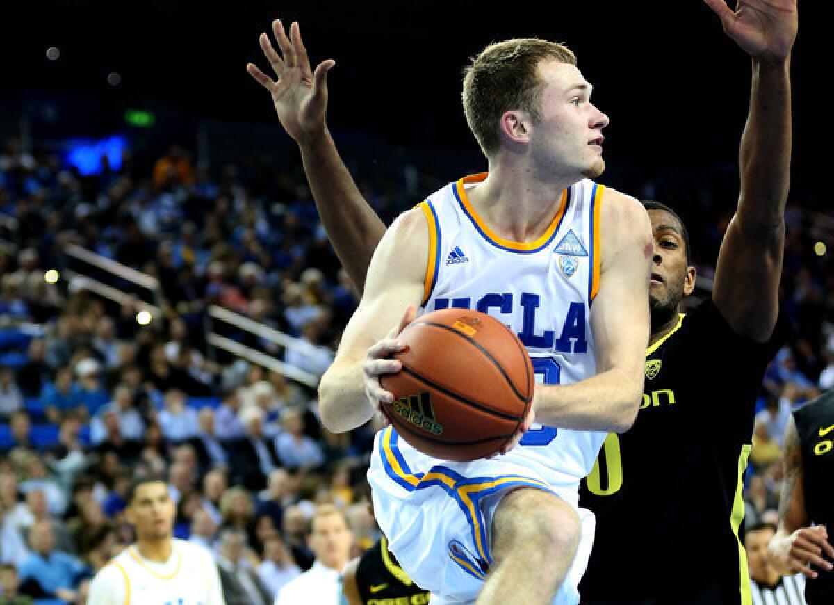 UCLA guard Bryce Alford looks to pass after driving the baseline against Oregon on Thursday night at Pauley Pavilion.
