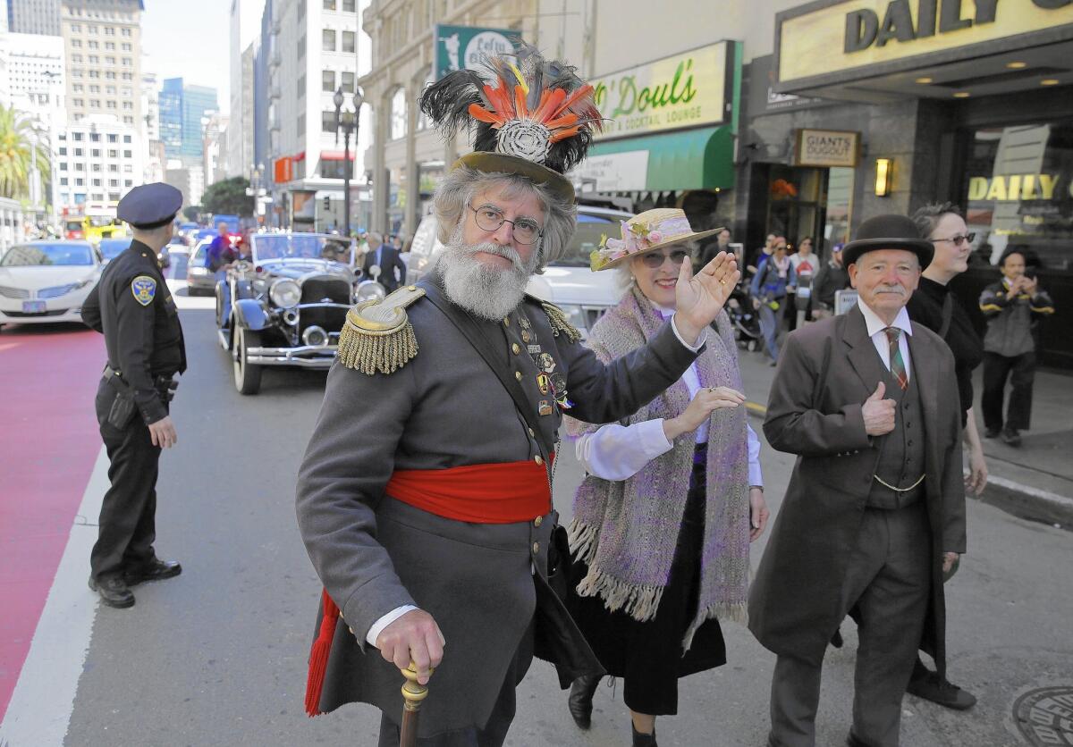 Historian Joseph Amster, center, marches in a parade Friday to commemorate the 110th anniversary of the great San Francisco earthquake and fire. The temblor struck April 18, 1906.