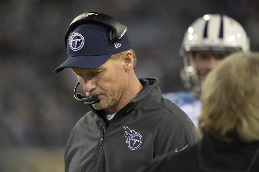 Tennessee Titans Coach Ken Whisenhunt looks down during the third quarter of a game against the Jacksonville Jaguars on Dec. 18.