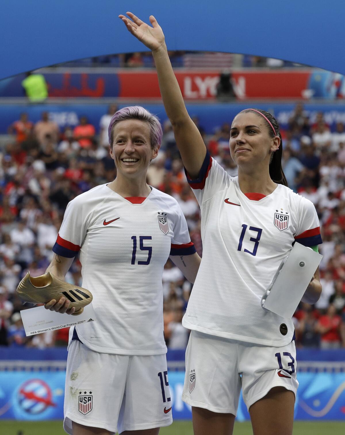 U.S. national teammates Megan Rapinoe and Alex Morgan react after winning the Women's World Cup final in 2019.