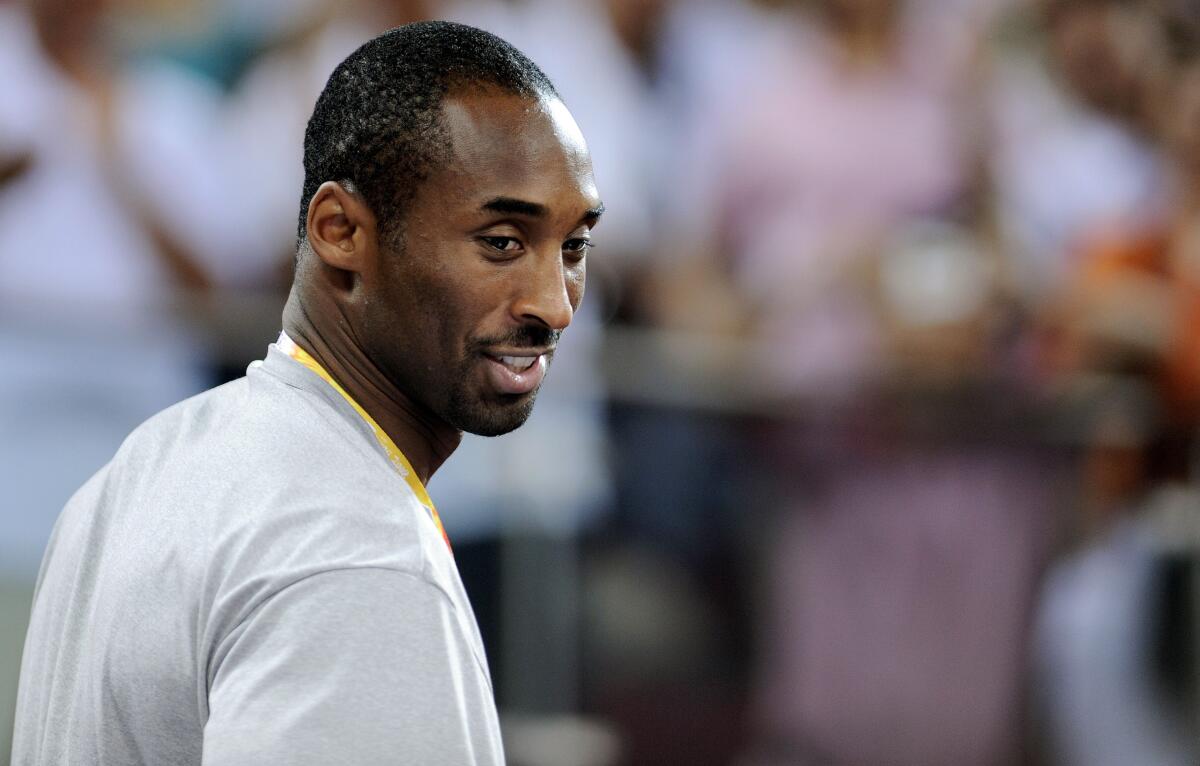 (FILES) In this file photo taken on August 09, 2008 US basketball player Kobe Bryant smiles as he arrives to follow the women's preliminary round group B match USA vs Czech Republic at the Olympic Basketball Arena in Beijing. - NBA legend Kobe Bryant died Sunday in a helicopter crash in suburban Los Angeles, celebrity website TMZ reported, saying five people are confirmed dead in the incident. (Photo by Filippo MONTEFORTE / AFP) (Photo by FILIPPO MONTEFORTE/AFP via Getty Images) ** OUTS - ELSENT, FPG, CM - OUTS * NM, PH, VA if sourced by CT, LA or MoD **