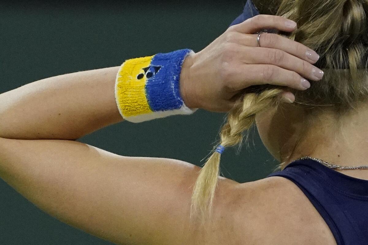 Dayana Yastremska wears a wrist ban of her nation's colors during her match Wednesday at the BNP Paribas Open.