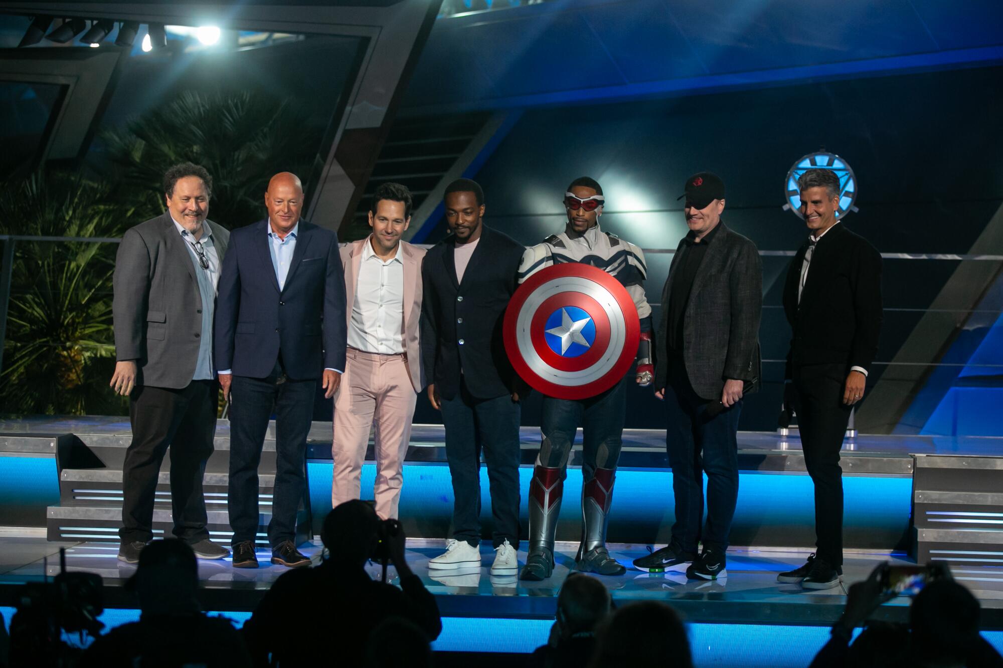 Jon Favreau, Paul Rudd and Anthony Mackie pose with the Captain America actor and Disney executives.