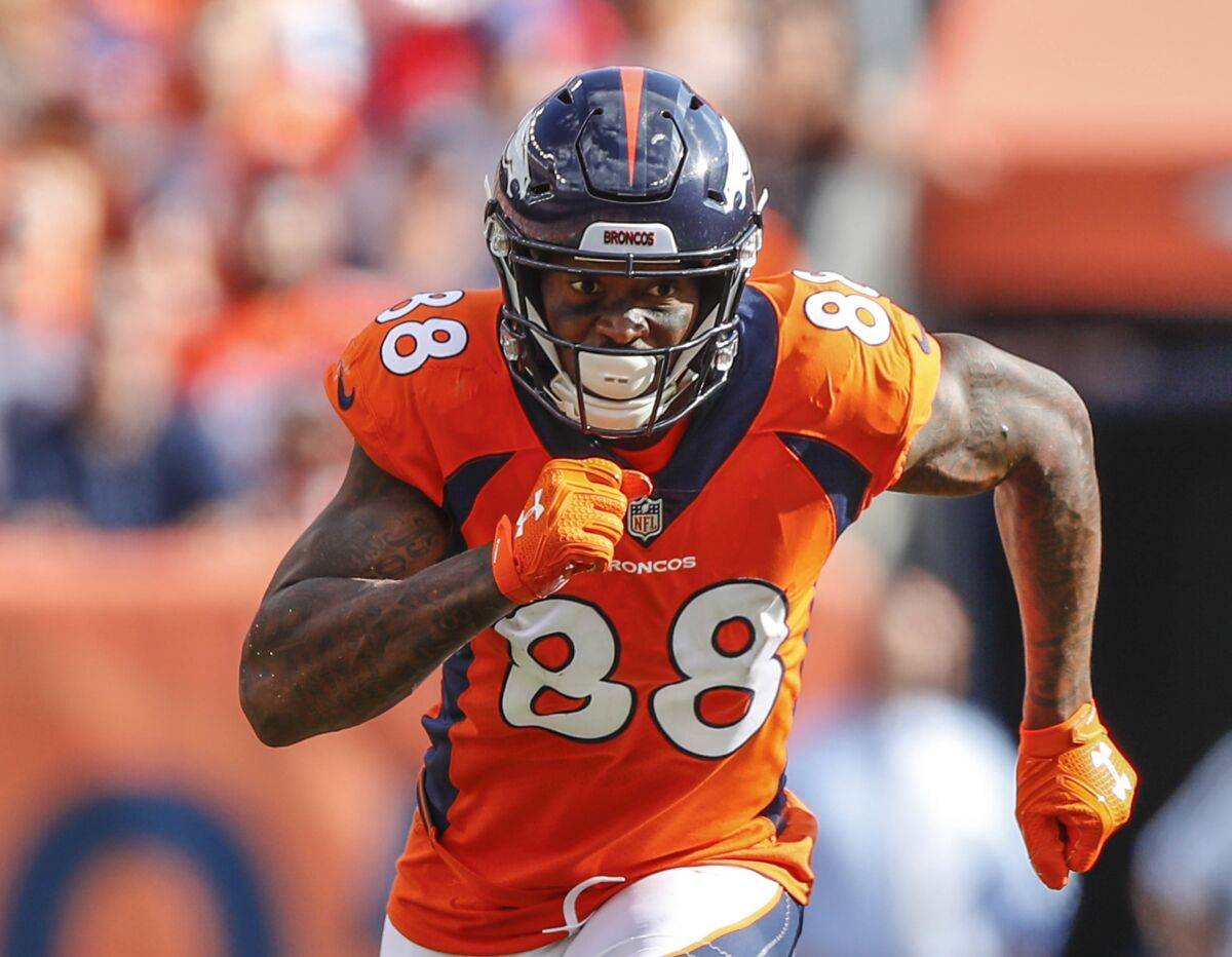 Quarterback Peyton Manning (18) congratulates Demaryius Thomas (88) after  scoring a touchdown – Denver Broncos History