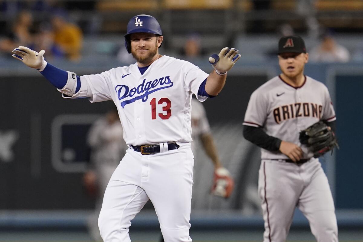 Max Muncy gestures after hitting a double in the first inning against the Diamondbacks on Tuesday.