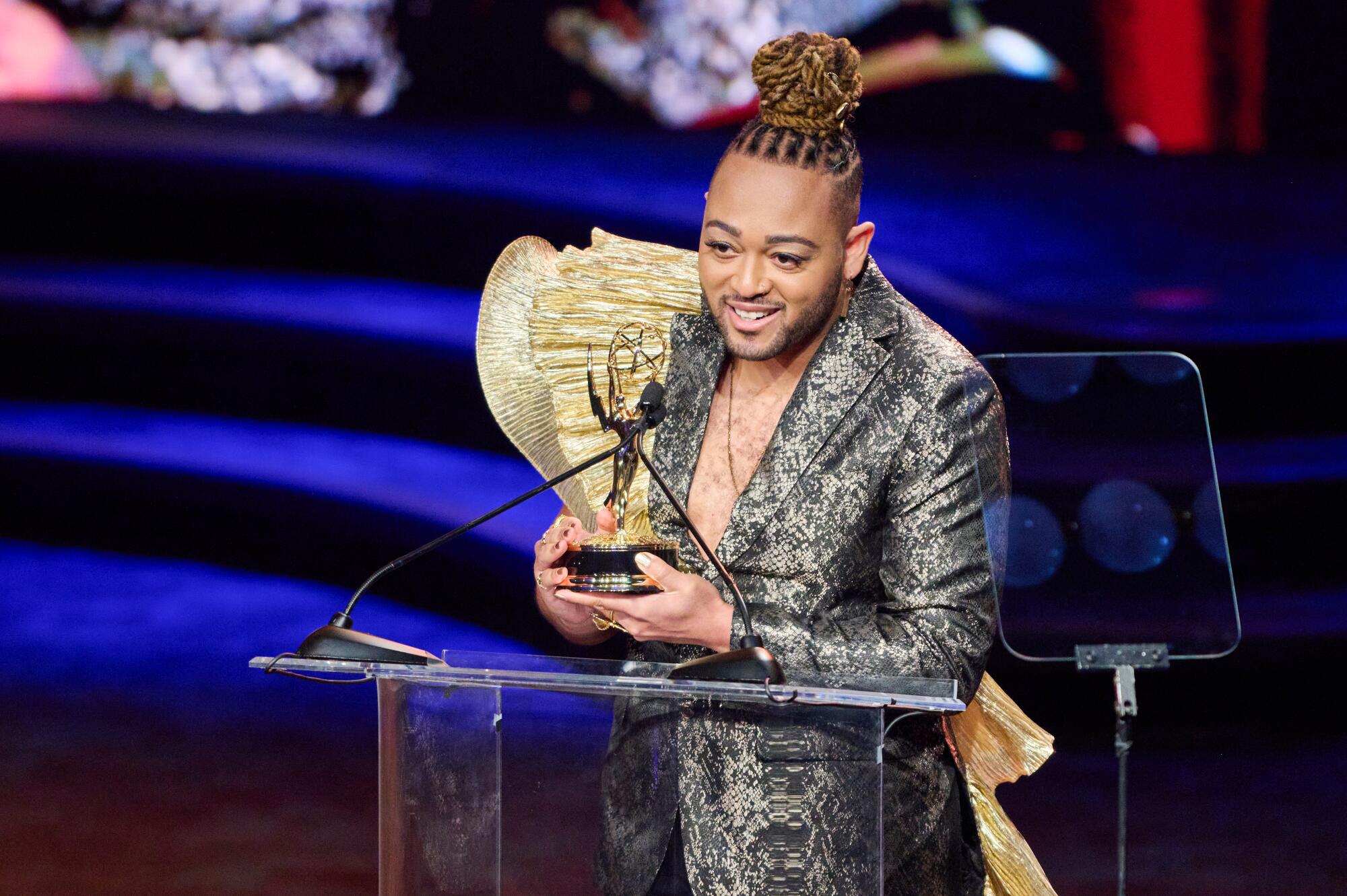Jeremy McQueen gives a speech after winning an Emmy Award for the film “WILD: These Walls Can Talk.”