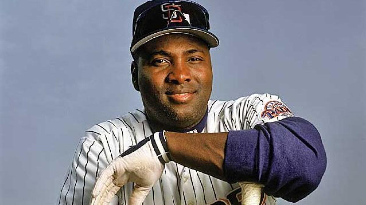 Hall of Fame ball player Tony Gwynn signs a 1998 jersey during