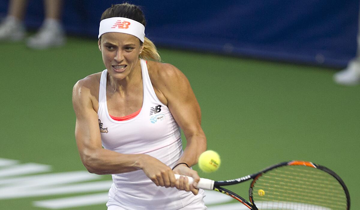 Nicole Gibbs makes a backhand return during a World Team Tennis match for the Orange County Breakers in 2016. Gibbs is making a comeback to the sport after undergoing surgery and treatment to remove a tumor in her mouth.