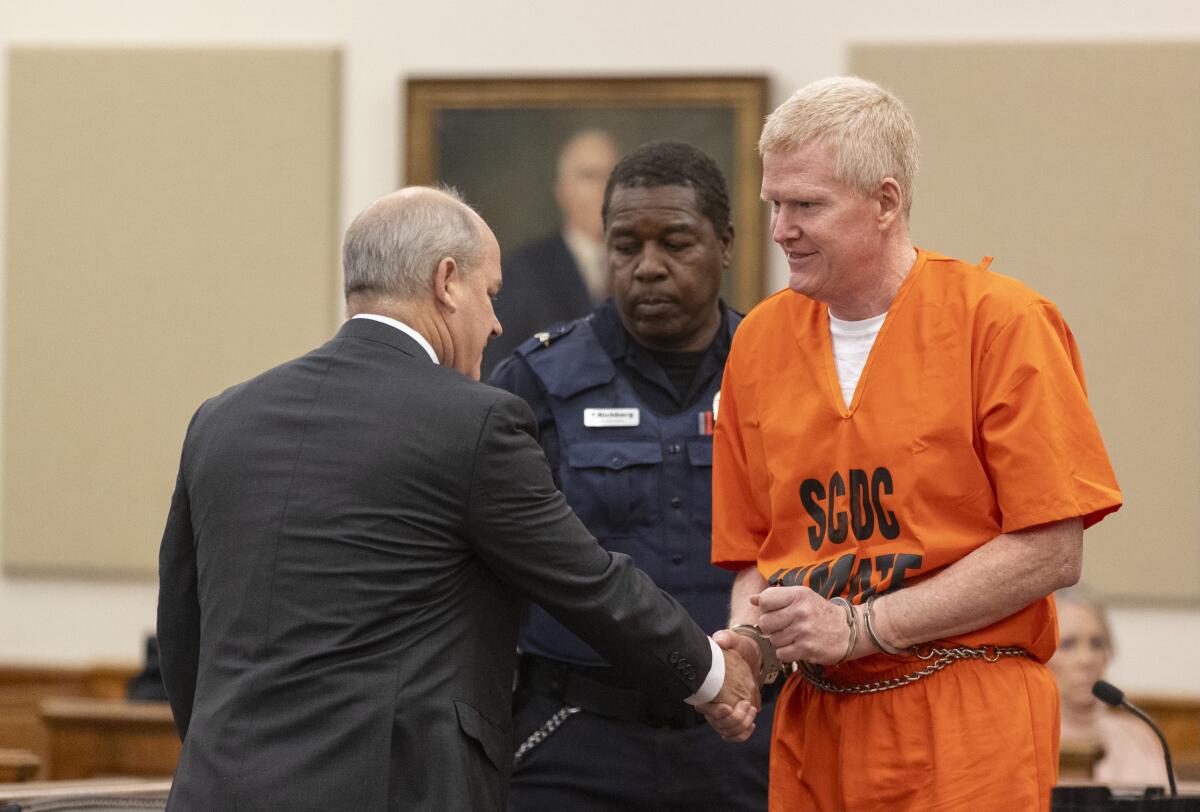 Alex Murdaugh, right, shaking hands with his attorney