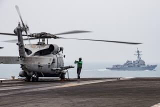 An MH-60R Sea Hawk on the flight deck of the USS Ronald Reagan in South China Sea, Thursday, July 9, 2020. 