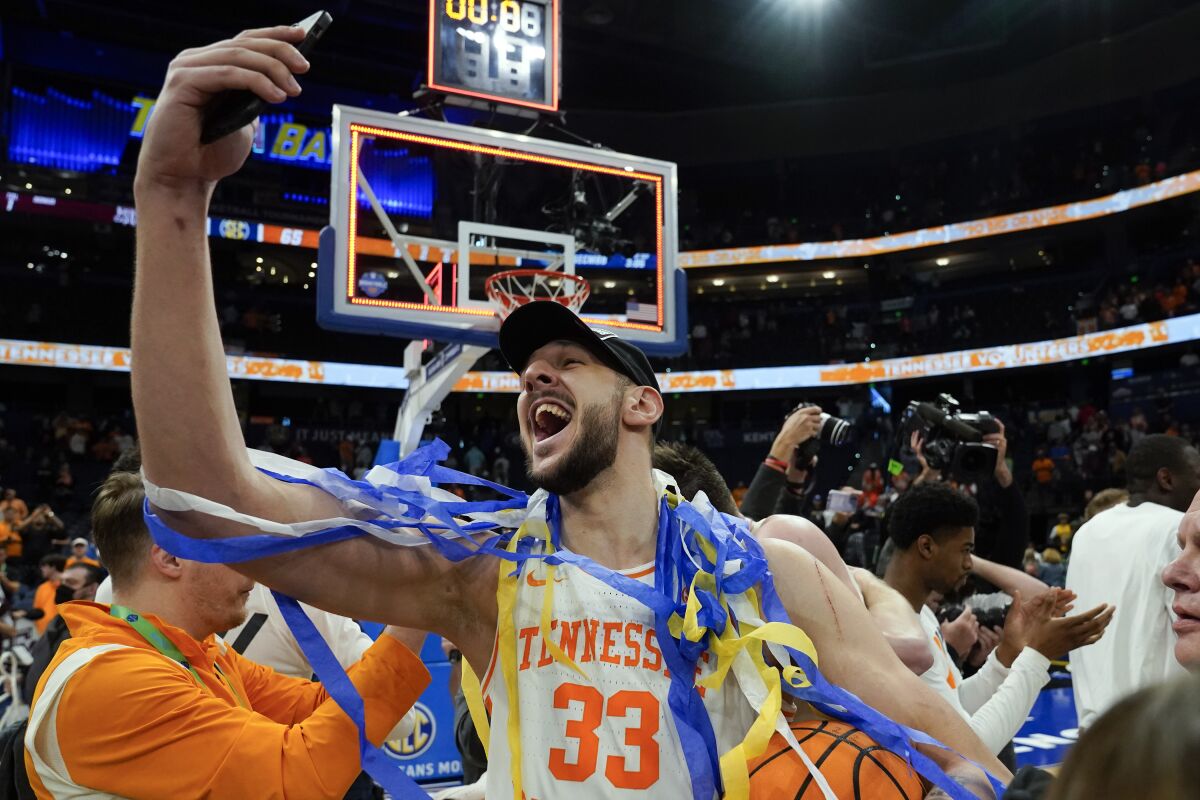 Tennessee forward Uros Plavsic (33) celebrates after the team defeated Texas A&M during an NCAA men's college basketball Southeastern Conference tournament championship game Sunday, March 13, 2022, in Tampa, Fla. (AP Photo/Chris O'Meara)