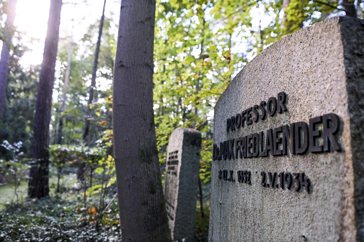 This Oct. 12, 2021 taken photo shows the grave of Max Friedlaender, a musicologist of Jewish faith at the Suedwestkirchhof Stahnsdorf, Germany. The German government's top official against antisemitism on Wednesday criticized the burial of a Holocaust denier on the former gravesite of a known Jewish musicologist. (Jens Kalaene/dpa via AP)