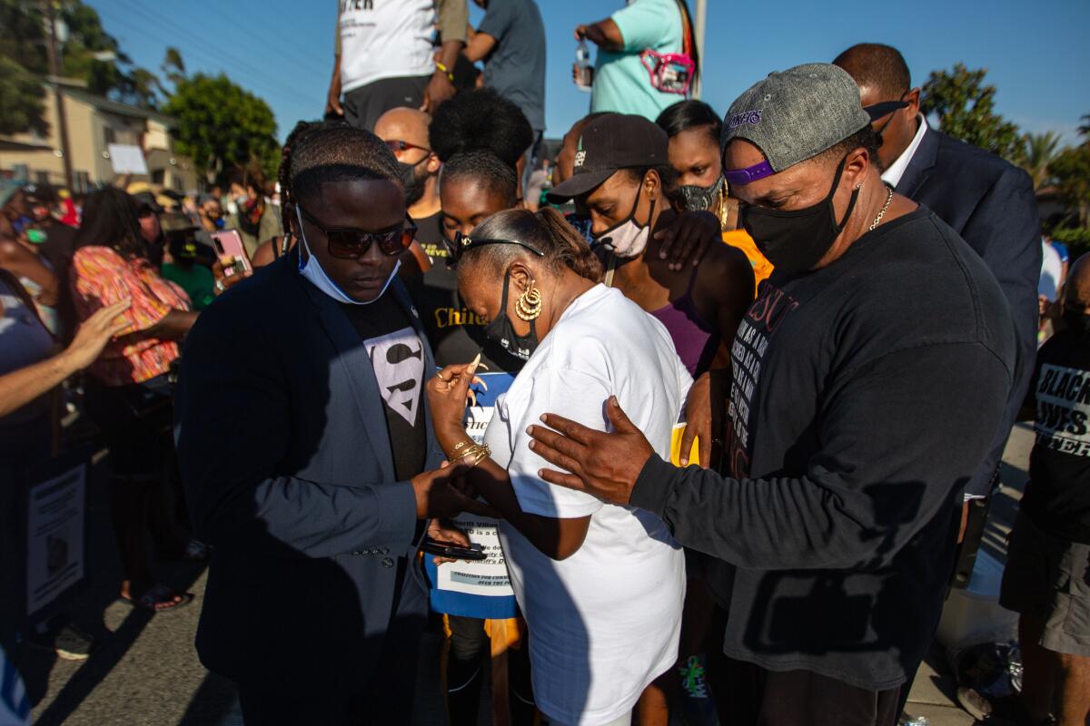 The family of Dijon Kizzee gathers with protesters in front of the South Los Angeles sheriff's station 