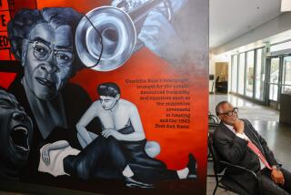 Los Angeles, CA - May 18: Councilmember Curren Price poses for a portrait with a mural depicting history of the Zoot Suit riots inside offices near the Central Avenue Farmer's Market on Thursday, May 18, 2023 in Los Angeles, CA. (Dania Maxwell / Los Angeles Times).