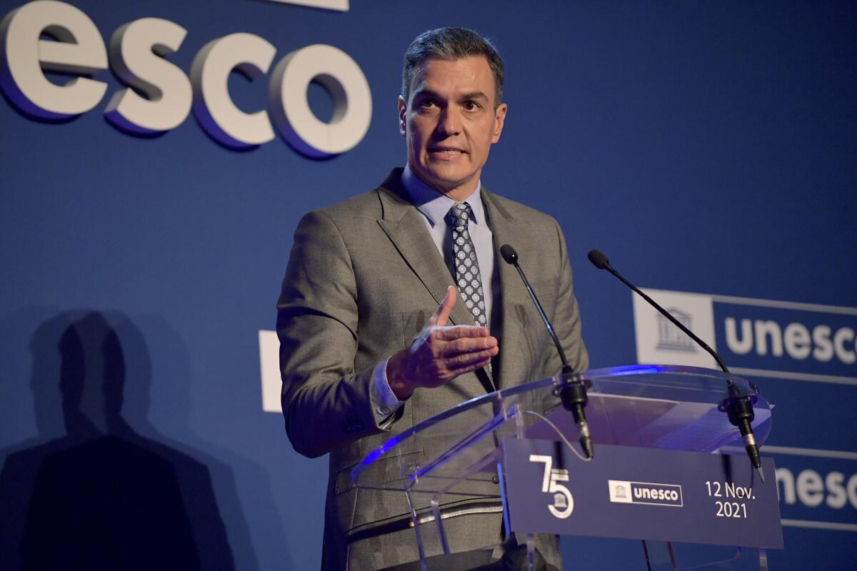 FILE - Spain's Prime Minister Pedro Sanchez delivers a speech at the UNESCO headquarters in Paris, Nov. 12, 2021. Spain’s prime minister is urging people to “remain prudent” about COVID-19 over the holidays as Christmas festivities at one Spanish hospital are suspected of infecting dozens of staff. Sanchez said Monday, Dec. 6 that Spaniards can't “let their guard down” because the coronavirus continues to spread. (Julien de Rosa, Pool Photo via AP, file)