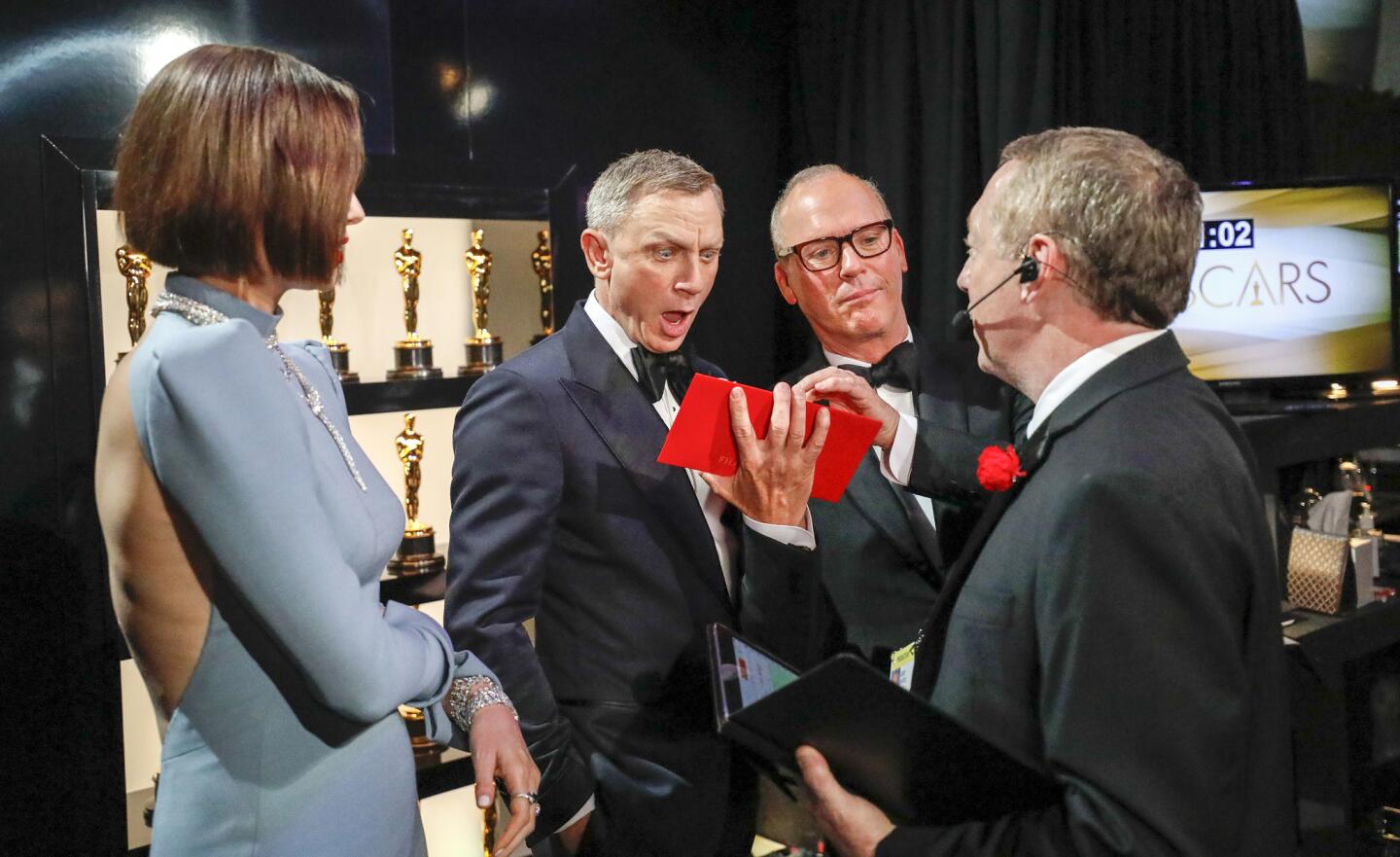 Presenters Charlize Theron, Daniel Craig and Michael Keaton backstage at the Dolby Theatre.