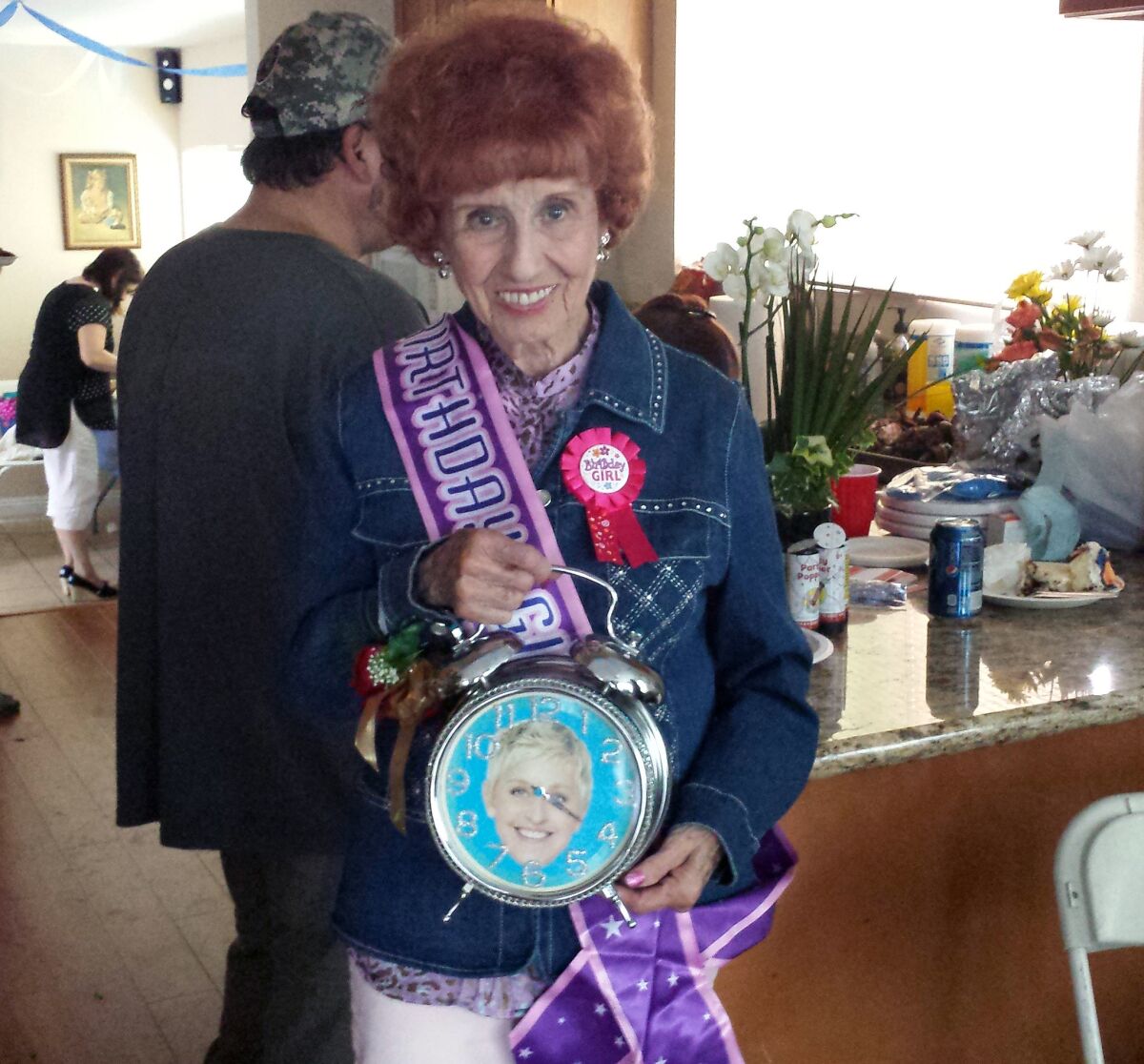 Elinor Otto, a "Rosie the Riveter" who still works for Boeing, at her surprise 94th birthday party with the clock given to her on the "Ellen" show.