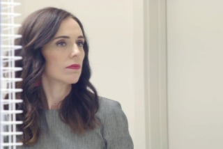 A woman leader looks into a mirror and considers an issue.